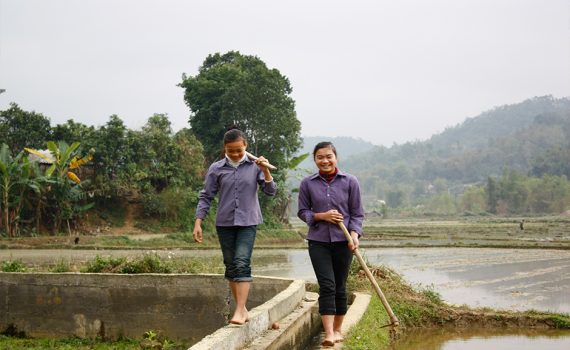 Farmers benefit from a ChildFund-supported irrigation system in Vy Huong